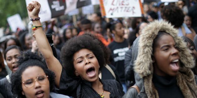 Demonstrators from the Black Lives Matter movement march through central London on July 10, 2016, during a demonstration against the killing of black men by police in the US. Police arrested scores of people in demonstrations overnight Saturday to Sunday in several US cities, as racial tensions simmer over the killing of black men by police. / AFP / DANIEL LEAL-OLIVAS (Photo credit should read DANIEL LEAL-OLIVAS/AFP/Getty Images)