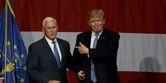 Indiana Gov. Mike Pence joins Republican presidential candidate Donald Trump at a rally in Westfield, Ind., Tuesday, July 12, 2016. (AP Photo/Michael Conroy)