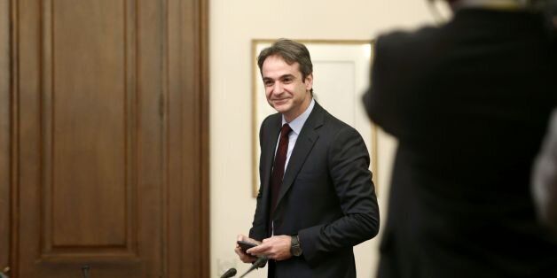 Kyriakos Mitsotakis, president of the Greek liberal-conservative New Democracy party, arrives to attend a meeting of political party leaders at the Presidential Mansion in Athens on March 4, 2016. / AFP / PANAYOTIS TZAMAROS (Photo credit should read PANAYOTIS TZAMAROS/AFP/Getty Images)