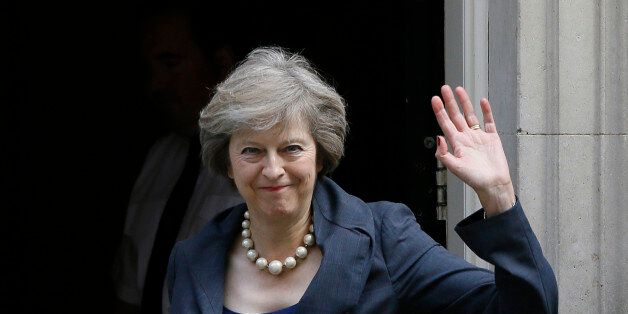 Britain's Home Secretary Theresa May waves towards the media as she arrives to attend a cabinet meeting at 10 Downing Street, in London, Tuesday, July 12, 2016. Theresa May will become Britain's new Prime Minister on Wednesday. (AP Photo/Kirsty Wigglesworth)