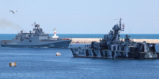 SEVASTOPOL, RUSSIA - JUNE 9, 2016: The Russian Black Sea Fleet's new frigate Admiral Grigorovich (L) arrives in Sevastopol. The vessel was escorted by NATO ships during its transition from the Baltic Fleet to the Black Sea Fleet. Alexander Karpushkin/TASS (Photo by Alexander Karpushkin\TASS via Getty Images)