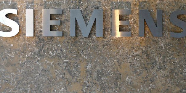 The logo of German industrial conglomerate Siemens is pictured prior to opening ceremony at the new headquarters in Munich, Germany, Friday, June 24, 2016. (AP Photo/Matthias Schrader)