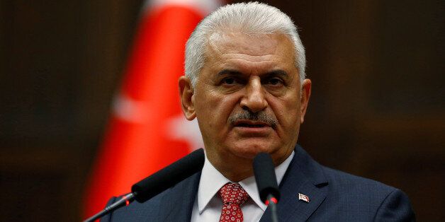 Turkey's Prime Minister Binali Yildirim addresses members of parliament from his ruling AK Party (AKP) during a meeting at the Turkish parliament in Ankara, Turkey, June 14, 2016. REUTERS/Umit Bektas