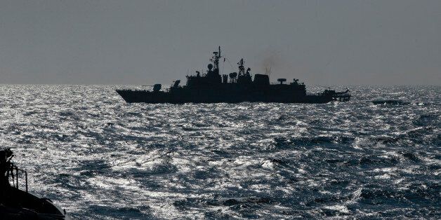 Turkish NATO warship TCG Turgutreis maneuvers on the Black Sea after leaving the port of Constanta, Romania, Monday, March 16, 2015. NATO ships take part in sea military exercises in the Black Sea region involving ships USS Vicksburg, as well as a German auxiliary ship and frigates from Canada, Turkey, Italy and Romania. (AP Photo/Vadim Ghirda)