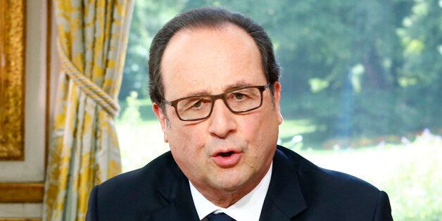 French President Francois Hollande gestures during a televised interview following the Bastille Day Parade in Paris, on July 14, 2016. / AFP / POOL / Francois Mori (Photo credit should read FRANCOIS MORI/AFP/Getty Images)