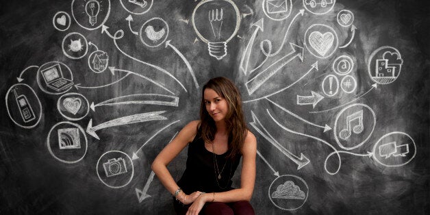 Girl in front of chalkboard with social media icon