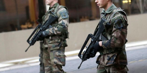 Soldiers patrol in the street of Nice, southeastern France, Wednesday, Feb. 4, 2015. France increased its security alert to its highest level for Nice and the region, one day after an attacker with a knife hidden in his bag attacked three soldiers on an anti-terror patrol in front of a Jewish community center in Nice, yesterday, Tuesday Feb. 3, 2015. France has been on high alert since the attacks in the Paris region by three Islamic extremists that left 20 people dead, including the gunmen. More than 10,000 soldiers have been deployed around the country to protect sensitive locations, including major shopping areas, synagogues, mosques and transit hubs. (AP Photo/Lionel Cironneau)