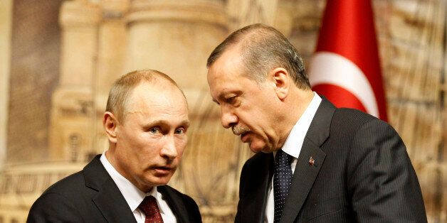 Russia's President Vladimir Putin (L) talks with Turkey's Prime Minister Tayyip Erdogan after their news conference in Istanbul December 3, 2012. REUTERS/Osman Orsal (TURKEY - Tags: POLITICS)