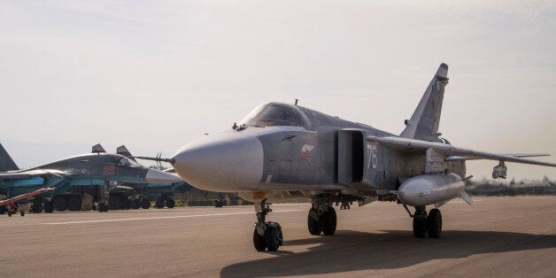 FILE - In this Oct. 22, 2015, file photo, a Russian Su-24 bomber rolls to take off on a combat mission at Hemeimeem airbase in Syria. Turkey shot down a Russian warplane Tuesday, Nov. 24, 2015, claiming it had violated Turkish airspace and ignored repeated warnings. Russia denied that the plane crossed the Syrian border into Turkish skies. (AP Photo/Vladimir Isachenkov, File)
