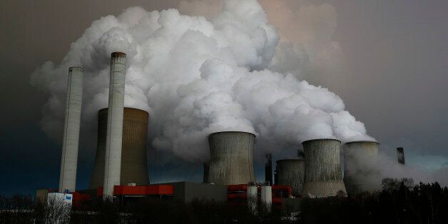 Steam rises from the cooling towers of the coal power plant of RWE, one of Europe's biggest electricity and gas companies in Niederaussem, north-west of Cologne, Germany. Picture taken March 3, 2016. REUTERS/Wolfgang Rattay