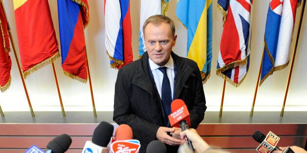 Polish Prime Minister Donald Tusk talks to journalists at the EU Headquarters on November 22, 2012 in Brussels, during a two-day European Union leaders summit called to agree a hotly-contested trillion-euro budget through 2020. European Union officials were scrambling to find an all but impossible compromise on the 2014-2020 budget that could successfully move richer nations looking for cutbacks closer to poorer ones who look to Brussels to prop up hard-hit industries and regions. AFP PHOTO / JOHN THYS (Photo credit should read JOHN THYS/AFP/Getty Images)