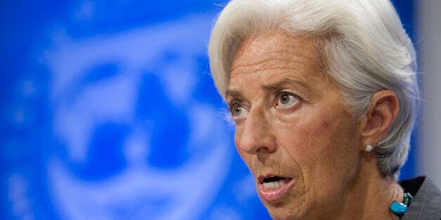 International Monetary Fund (IMF) Managing Director Christine Lagarde speaks during a news conference, Wednesday, June 22, 2016, in Washington. The IMF downgraded its forecast for the U.S. economy this year and said America should raise the minimum wage to help the poor, offer paid maternity leave to encourage more women to work and overhaul the corporate tax system to boost productivity. (AP Photo/Cliff Owen)