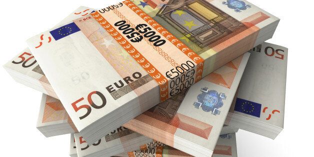 Stack of Euro 50 bills on white background, close-up, high angle view