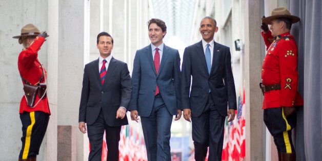 President Barack Obama walks with Canadian Prime Minister Justin Trudeau and Mexican President Enrique Pena Neito at the National Gallery of Canada in Ottawa, Canada, Wednesday, June 29, 2016. Obama traveled to Ottawa for the North America Leaders' Summit. (AP Photo/Pablo Martinez Monsivais)