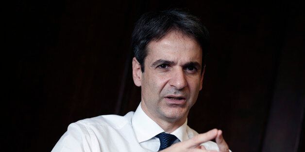 Greek Administrative Reform Minister Kyriakos Mitsotakis speaks during an interview with the Associated Press in Athens, Tuesday, April 8, 2014. Mitsotakis said years of austerity have left Greece with about 200,000 fewer civil servants than before its debt crisis erupted in late 2009. He added that the country has made significant overall progress, which should allow it to tap international capital markets