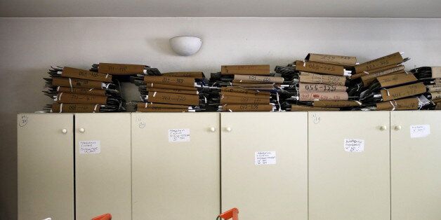 Tax archives are seen piled up inside a tax office in Athens, Greece, June 25, 2015. Monthly reports by Greece's financial crimes units highlight just how common tax dodging is, from doctors to farmers to contractors and civil servants. That, and the prevalence of small- and medium-sized businesses and the self-employed, as well as the sizeable shadow economy, shows just how difficult it is to crack down on Greece's corruption and tax evasion, which leftist Prime Minister Alexis Tsipras has made one of his priorities. To match Insight EUROZONE-GREECE/TAXES REUTERS/Alkis Konstantinidis