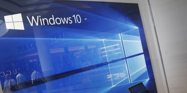 A display for the Windows 10 operating system is seen in a store window at the Microsoft store at Roosevelt Field in Garden City, New York July 29, 2015. Microsoft Corp's launch of its first new operating system in almost three years, designed to work across laptops, desktop and smartphones, won mostly positive reviews for its user-friendly and feature-packed interface.REUTERS/Shannon Stapleton