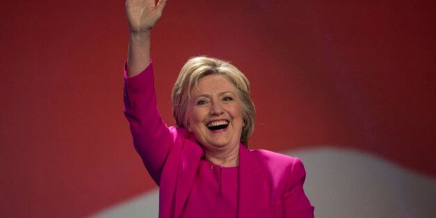Democratic presidential candidate Hillary Clinton waves as she arrives to address the The National Education Association (NEA) Representative Assembly in Washington D.C., Tuesday, July 5, 2016. FBI Director James Comey said Tuesday, the FBI will not recommend criminal charges in its investigation into Hillary Clinton's use of a private email server while secretary of state. (AP Photo/Molly Riley)
