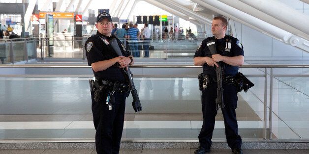 NEW YORK, NY - JUNE 30: Port Authority police officers stand guard near a departures entrance at John F. Kennedy International Airport (JFK), June 30, 2016 in the Queens borough of New York City. Following Tuesday's terrorist attacks at Instanbul's Ataturk Airport, the Transportation Security Administration and other law enforcement agencies have increased security at major airports in the United States. (Photo by Drew Angerer/Getty Images)