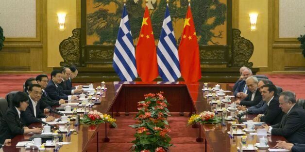 Greek Prime Minister Alexis Tsipras (2nd R) leads his delegation during talks with Chinese Premier Li Keqiang (2nd L) at the Great Hall of the People in Beijing on July 4, 2016. The / AFP / POOL / Ng Han Guan (Photo credit should read NG HAN GUAN/AFP/Getty Images)