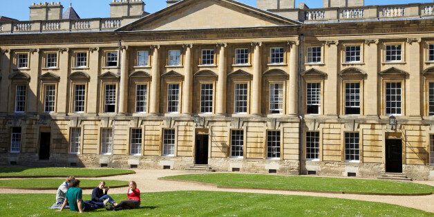 Students sitting outside in spring sunshine, Peckwater Quadrangle, designed by Henry Aldrich, Christ Church, Oxford University, Oxford, Oxfordshire, England, United Kingdom, Europe