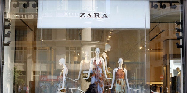 A woman looks at a display window in a Zara store in Madrid, Spain, June 15, 2016. REUTERS/Paul Hanna