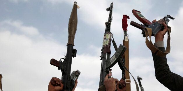 Tribesmen loyal to Houthi rebels hold their weapons during a gathering aimed at mobilizing more fighters into battlefronts in several Yemeni cities, in Sanaa, Yemen, Monday, June 20, 2016. Yemen's civil war has killed some 9,000 people since March 2015 â a third of them civilians, according to the United Nations. (AP Photo/Hani Mohammed)