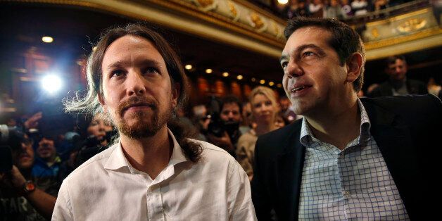 Podemos ('We can') Secretary General Pablo Iglesias (L) and Alexis Tsipras, leader of Greece's Syriza party, arrive at a meeting in central Madrid November 15, 2014. REUTERS/Juan Medina (SPAIN - Tags: POLITICS)