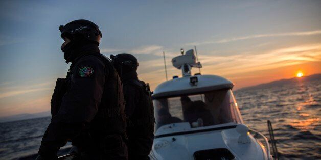 Members of the Frontex, European Border Protection Agency, from Portugal patrol as the sun rises near the northeastern Greek island of Lesbos, Tuesday, Dec. 8, 2015. Greece is the main point of entry into the EU for people fleeing war and poverty at home, with the vast majority of the 700,000 people who have entered the country this year reaching Greek islands from the nearby Turkish coast. (AP Photo/Santi Palacios)