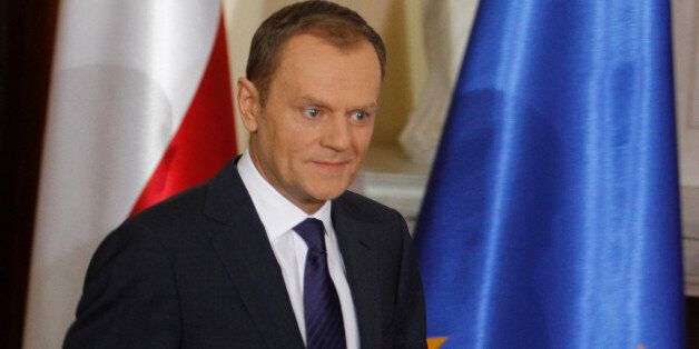 Poland's Prime Minister Donald Tusk arrives for a press conference in Warsaw, Poland, on Thursday, Jan. 13, 2011 describing a report by Russian aviation authorities on last year's plane crash that killed the nation's President Lech Kaczynski and 95 others as