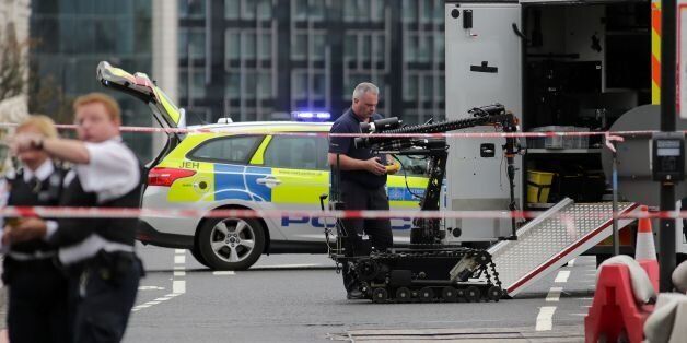Police prepare to send a robot to investigate an abandoned car on Westminster Bridge, close to the Palace of Westminster in central London on June 28, 2016.The bridge was closed to tarffic and pedestrians while the police sent a robot to check on the vehicle on Tuesday afternoon. / AFP / DANIEL LEAL-OLIVAS (Photo credit should read DANIEL LEAL-OLIVAS/AFP/Getty Images)