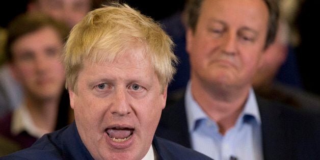 Britain's Prime Minister David Cameron, right, listens as current Mayor of London Boris Johnson speaks at a mayoral election campaign rally for Britain's Conservative party candidate for Mayor of London Zac Goldsmith at a school in Ham, a suburb in south west London, Tuesday, May 3, 2016. The Mayor of London election takes place on Thursday. (AP Photo/Matt Dunham)