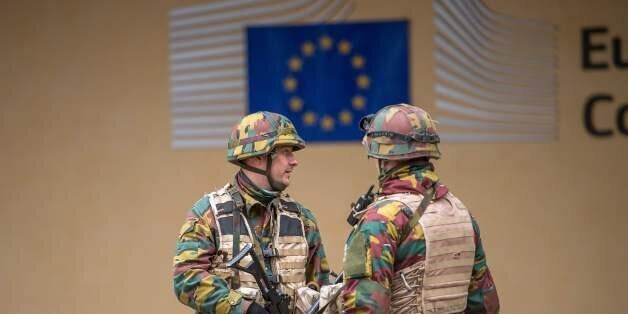 Belgian troops stand guard outside the EU Commission headquarters in Brussels on March 24, 2016, two days after terror attacks hit the Belgian capital.More than 30 people have been identified as being involved in a network behind the Paris attacks on November 13, with links now established to this week's bombings in Brussels. / AFP / PHILIPPE HUGUEN (Photo credit should read PHILIPPE HUGUEN/AFP/Getty Images)