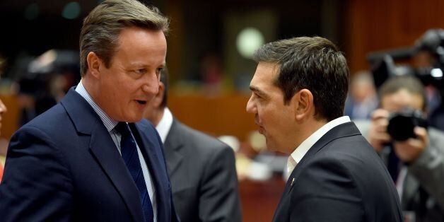 Britain's Prime minister David Cameron (L) talks with Greek Prime Minister Alexis Tsipras (R) during EU - Summit at the EU headquarters in Brussels on June 28, 2016.Prime Minister David Cameron said today he wants the 'closest possible' relations with the EU after Britain voted to leave the bloc, adding the split should be 'as constructive as possible'. As he arrived at a Brussels summit, Cameron, who is to step down within weeks, told reporters that, while Britain was leaving the EU, 'we mustn't be turning our backs on Europe.' / AFP / STEPHANE DE SAKUTIN (Photo credit should read STEPHANE DE SAKUTIN/AFP/Getty Images)