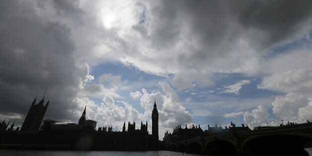 Clouds gather above the Houses of Parliament on the banks of the river Thames following yesterday's EU referendum result, London, Saturday, June 25, 2016. Britain voted to leave the European Union after a bitterly divisive referendum campaign. (AP Photo/Tim Ireland)