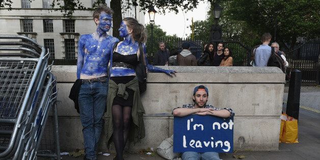 LONDON, ENGLAND- JUNE 24: A young couple painted as EU flags protest on outside Downing Street against the United Kingdom's decision to leave the EU following the referendum on June 24, 2016 in London, United Kingdom. The United Kingdom has gone to the polls to decide whether or not the country wishes to remain within the European Union. After a hard fought campaign from both REMAIN and LEAVE the vote is too close to call. A result on the referendum is expected on Friday morning. (Photo by Mary Turner/Getty Images)
