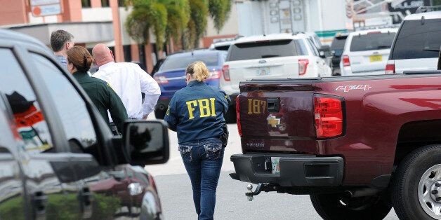 ORLANDO, FLORIDA - JUNE 12: FBI agents seen outside of Pulse nightclub after a fatal shooting and hostage situation where 20 people died on June 12, 2016 in Orlando, Florida. The suspected shooter, Omar Mateen, was shot and killed by police. 50 people are reported dead and 53 were injured in what is now the worst mass shooting in U.S. history. (Photo by Gerardo Mora/Getty Images)