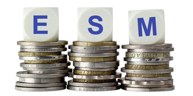 Stacks of coins with the letters ESM isolated on white background