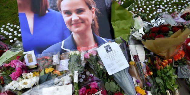 LONDON, UNITED KINGDOM - JUNE 17: Tributes are seen at Parliament Square after the murder of Jo Cox, 41, Labour MP, who was shot and stabbed yesterday by an attacker, in London, United Kingdom on June 17, 2016. Labour Party MP Jo Cox died of her injuries after being hospitalized following the attack in the town of Birstall, near Leeds in northern England. (Photo by Kate Green/Anadolu Agency/Getty Images)