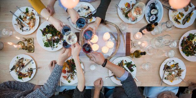 View from above friends toasting wine glasses