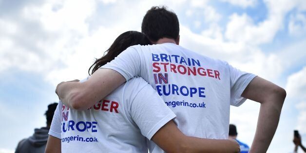 People wear 'Stronger-In' themed t-shirsts as they lsten to speakers at a rally for 'Britain Stronger in Europe', the official 'Remain' campaign group seeking to a avoid Brexit, ahead of the the forthcoming EU referendum, in Hyde Park in London on June 19, 2016.The International Monetary Fund (IMF) warned last week that if Britain votes to exit the European Union on June 23, it could deal the economy a 'negative and substantial' blow. / AFP / BEN STANSALL (Photo credit should read BEN STANSALL/AFP/Getty Images)