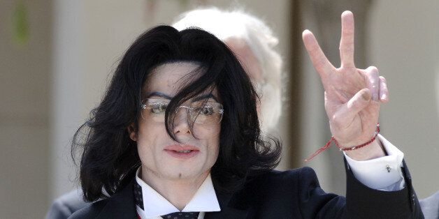 Michael Jackson gestures to his fans as he leaves the Santa Barbara county courthouse in Santa Maria, California. Michael Jackson gestures to his fans as he leaves the Santa Barbara county courthouse in Santa Maria, California, May 13, 2005. Prosecutors say the singer used his star power as a predatory tool to ingratiate himself with young boys and their families. Defense lawyers say opportunists have sought to profit from Jackson's generosity and to sully his love for children. REUTERS/Phil Kl
