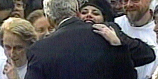 In this image taken from video, Monica Lewinsky embraces President Clinton as he greeted well-wishers at a White House lawn party in Washington Nov. 6, 1996. (AP Photo/APTV)
