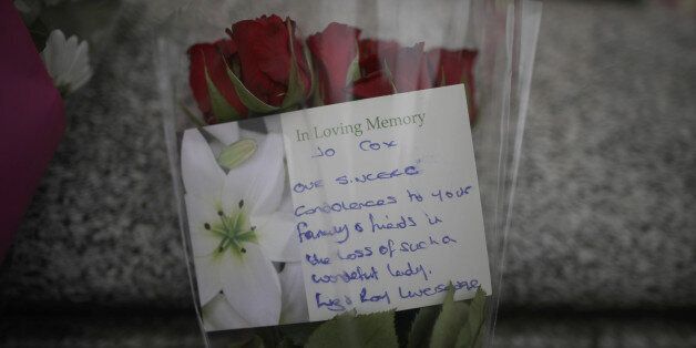 BIRSTALL, UNITED KINGDOM - JUNE 17: Flowers and tributes are left in Market Square, Birstall, after Jo Cox, 41, Labour MP for Batley and Spen, was shot and stabbed yesterday by an attacker at her constituency surgery, on June 17, 2016 in Birstall, England. Jo Cox MP was shot and stabbed while holding her weekly surgery at Birstall Library, Birstall near Leeds and later died form her injuries at Leeds Infirmary. 52-year old Thomas Mair has been arrested in connection with the crime. (Photo by Christopher Furlong/Getty Images)