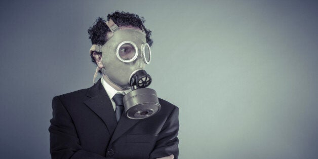 Nuclear, Business man wearing a gask mask, pollution concept