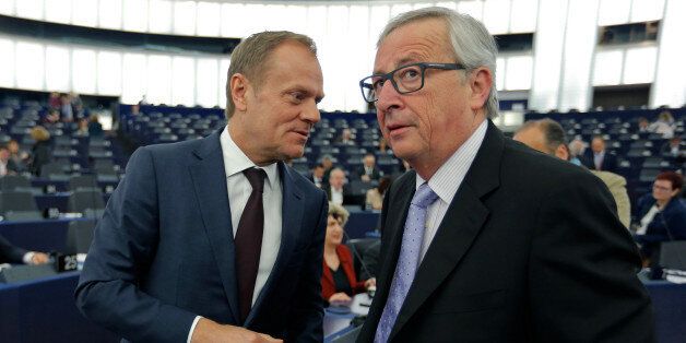 European Council President Donald Tusk (L) talks with European Commission President Jean-Claude Juncker ahead of a debate on the conclusions of last March 17 and 18 European Council meeting and the outcome of the EU-Turkey summit, at the European Parliament in Strasbourg, France, April 13, 2016. REUTERS/Vincent Kessler