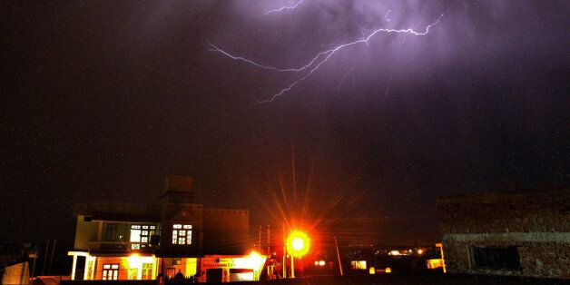 Streaks of lightning illuminate the night sky during a thunder shower in Jammu, India, Saturday, June 2, 2007. Eleven people were killed and four others injured when lightning struck them in Marathwada region of Indian state of Maharashtra in the last 24 hours, Press Trust of India reported Saturday. (AP Photo/Channi Anand)