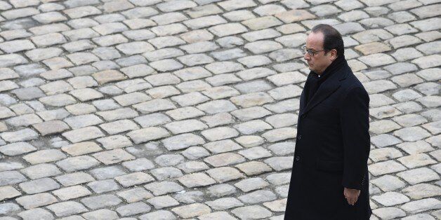 French President Francois Hollande attends the 'national and republican' tribute, a solemn ceremony in honour of the 130 people killed in the November 13 Paris attacks, on November 27, 2015 at the 'Hotel des Invalides'. Families of those killed in France's worst-ever terror attack, claimed by the Islamic State (IS) group, will join some of the wounded at ceremonies at the Invalides. AFP PHOTO / MIGUEL MEDINA / AFP / MIGUEL MEDINA (Photo credit should read MIGUEL MEDINA/AFP/Getty Images)