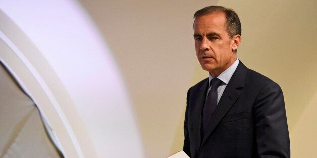 Governor of the Bank of England Mark Carney arrives to host his quarterly inflation report press conference at the Bank of England in central London, on May 12, 2016. The Bank of England warned that uncertainty over the outcome of next month's EU referendum was already weighing on British growth, as it left interest rates unchanged. 'There are increasing signs that uncertainty associated with the EU referendum has begun to weigh on activity' ahead of the June 23 vote, the BoE said as it gave its