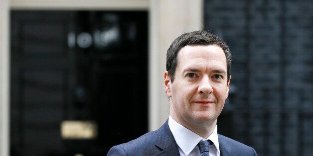 Britain's Chancellor George Osborne walks across Downing Street on his way to attend a press conference at the Foreign Office with Christine Lagarde, in London, Friday, May 13, 2016. (AP Photo/Kirsty Wigglesworth)